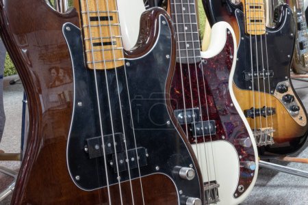 Lafayette - Circa December 2022: Fender Jazz and Precision bass guitar display at a music store. Fender bass guitars are popular among recording artists.