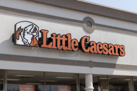 Photo for Logansport - Circa April 2023: Little Caesars Pizza Franchise. Little Caesars is a carry-out chain featuring pizza and crazy bread. - Royalty Free Image