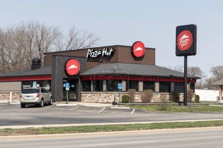 Photo for Peru - Circa April 2023: Pizza Hut restaurant. Pizza Hut is offering delivery, Carry Out and Curbside Pickup pizza and drinks. - Royalty Free Image