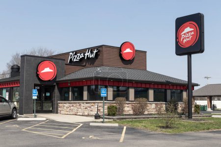 Photo for Peru - Circa April 2023: Pizza Hut restaurant. Pizza Hut is offering delivery, Carry Out and Curbside Pickup pizza and drinks. - Royalty Free Image