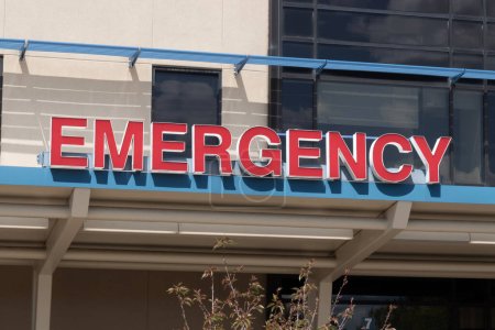 Emergency Room and Emergency Department entrance sign for a hospital in alert red.