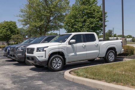 Photo for Fishers - Circa May 2023: Nissan Frontier pickup truck display at a dealership. Nissan offers the Frontier in King and Crew cab models. - Royalty Free Image