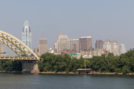 Photo for Cincinnati - June 8, 2023: Cincinnati Downtown Skyline including the Great American tower and Daniel Carter Beard Bridge along the Riverfront. - Royalty Free Image
