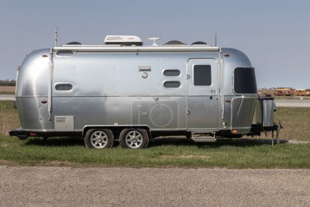 Photo for Bunker Hill - April 8, 2023: Airstream Flying Cloud fifth wheel travel trailer by Thor RV. Thor Industries builds RVs, motorhomes and fifth wheels. - Royalty Free Image