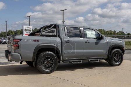 Photo for Fishers - September 10, 2023: Nissan Frontier pickup truck display at a dealership. Nissan offers the Frontier in King and Crew cab models. - Royalty Free Image