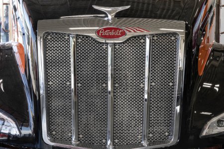 Photo for Indianapolis - March 20, 2024: Peterbilt Semi Tractor Trailer Trucks logo and truck grille. Peterbilt is owned by PACCAR Trucks. - Royalty Free Image