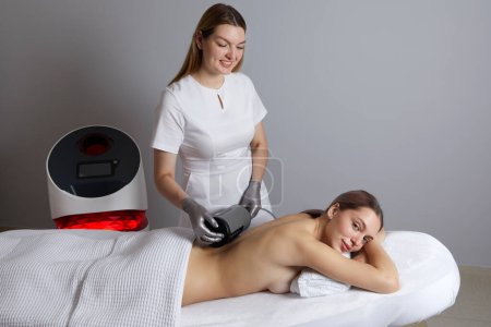 Photo for Endosphere therapy of female body by a cosmetologist in beauty salon - Royalty Free Image