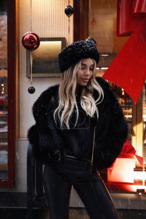 Photo for Fashion photo of beautiful sexy woman with blond hair wearing elegant fur coat and hat in slavic style - Royalty Free Image