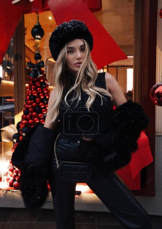 Photo for Fashion photo of beautiful sexy woman with blond hair wearing elegant fur coat and hat in slavic style - Royalty Free Image