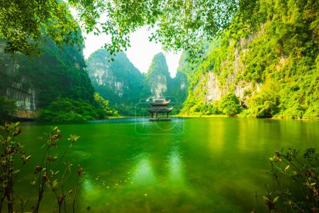 Photo for Sacred temple in the middle of the river, surrounding by limestone cliff - Royalty Free Image