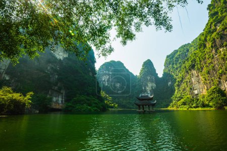 Photo for Sacred temple in the middle of the river, surrounding by limestone cliff - Royalty Free Image
