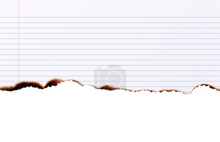 Notebook paper burned half isolated on white background with clipping path
