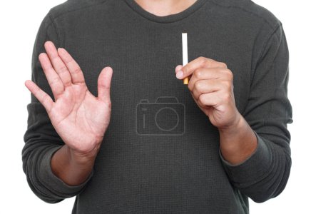 Photo for World No Tobacco Day. Man holding cigarette and making stop gesture with palm of hand. Stop smoking cigarettes concept. No smoking campaign - Royalty Free Image