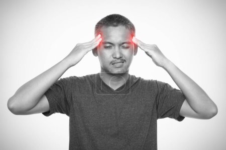 Photo for Man with strong headache. Isolated on gray background. Healthcare and health problem concept - Royalty Free Image