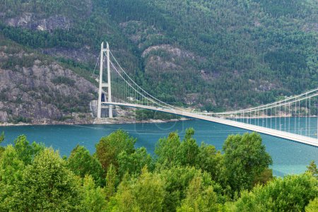 Photo for Hardanger Bridge. The longest suspension bridge in Norway. Hardangerbrua connecting two sides of Hardangerfjorden - Royalty Free Image