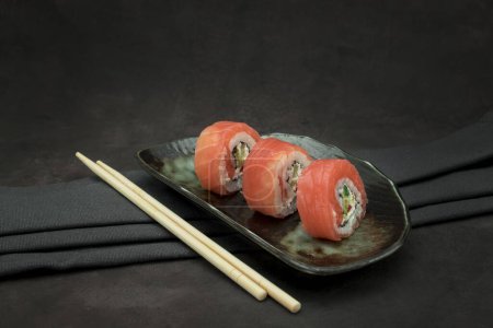 Photo for A set of delicious sushi on dark background - Royalty Free Image