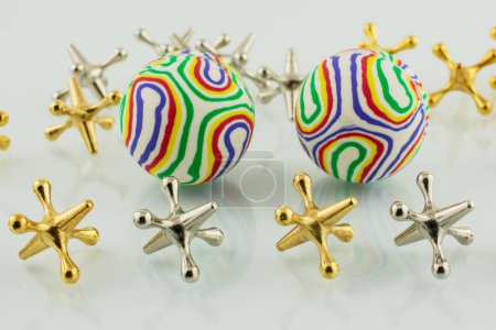 Colorful Jacks and Balls on white background