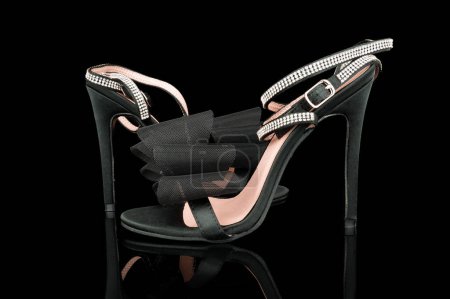 Photo for High heel shoes  on a black background - Royalty Free Image