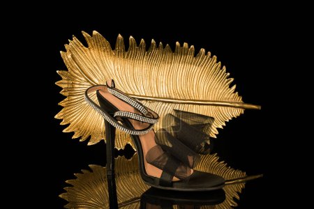 Photo for Sexy,  high heel shoes on black and gold background - Royalty Free Image