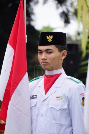 Foto de Paskibraka (Indonesian flag raiser) with national flag during grebeg pancasila - Imagen libre de derechos