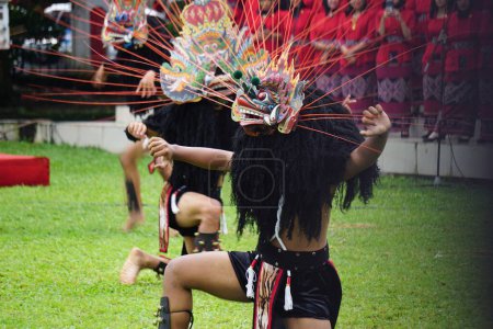 Foto de Indonesian perform barongan kucingan dance. This dance come from blitar, East Java, Indonesia - Imagen libre de derechos