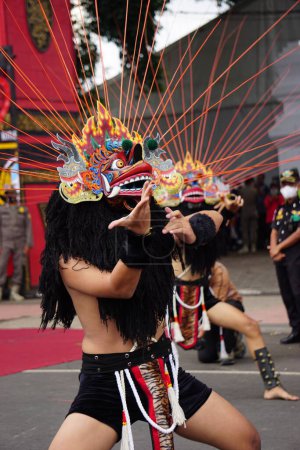 Photo for Indonesian perform barongan kucingan dance. This dance comes from blitar - Royalty Free Image