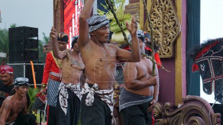 Photo for Tiban dance originates from East Java. Tiban comes from the word "tiba" in Javanese which means "fall". Tiban is a dance or ritual to wish for rain - Royalty Free Image