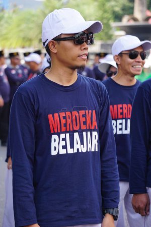 Photo for Indonesian teacher with a t-shirt merdeka belajar (independent learning) - Royalty Free Image