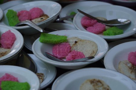 Photo for Dawet serabi for buyers at a traditional market. It's traditional Javanese food of rice flour strands curled up into a ball; eaten with coconut milk and palm sugar - Royalty Free Image