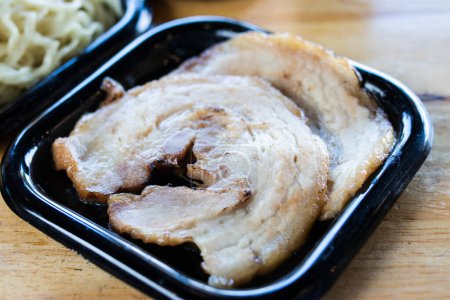 Photo for Sliced Japanese chashu pork on a black tray - Royalty Free Image