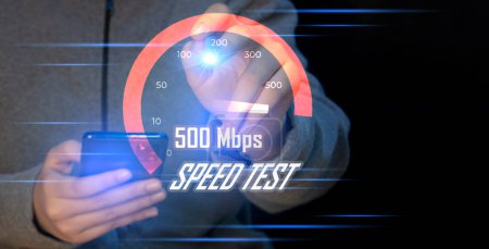 Photo for Fast internet connection speedtest network bandwidth technology Man using high speed internet with smartphone and laptop computer. 5G quality, speed optimization. - Royalty Free Image