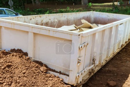 Photo for As part of construction site waste removal process metal container used for recycling garbage trash dumpster is used - Royalty Free Image