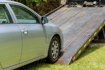 Photo for Loading damage broken car on tow truck vehicle working in towing service - Royalty Free Image