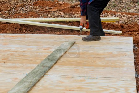 Photo for Building shed deck foundation using wood framing beams stick framework is an excellent idea - Royalty Free Image