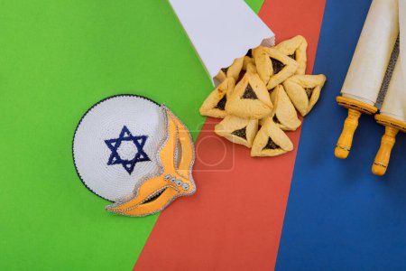 Foto de Purim is celebrated on 14th day of Hebrew month Adar, which usually traditional kosher foods eaten hamantaschen cookies - Imagen libre de derechos