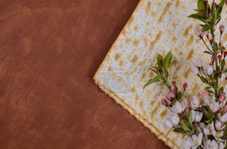 Photo for Unleavened matzah bread eaten during Passover is symbol of haste with which Jewish people left Egypt. - Royalty Free Image