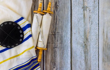 Photo for Jewish traditions it torah parchment scroll pray shawl tallit kippah in synagogue, holyday symbols - Royalty Free Image
