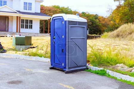 Photo for Portable temporary toilet is located on construction site during build home - Royalty Free Image