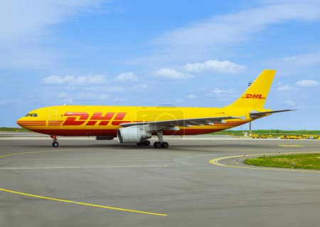 Photo for 27 April 2023 Austria, VIE Vienna At Vienna airport VIE in Austria DHL Airbus A300-600F plane is preparing to depart on runway - Royalty Free Image