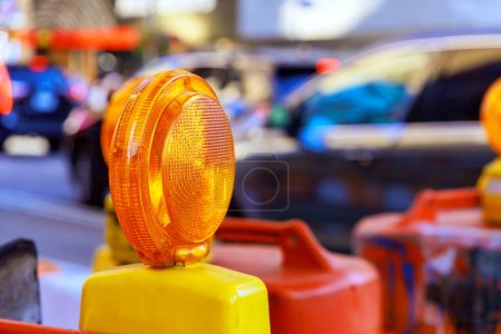 Photo for Construction warning yellow light on barricade intended to warn of in construction site - Royalty Free Image