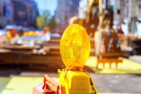 Photo for Close up of yellow warning orange construction light on barricade intended to warn construction site. - Royalty Free Image