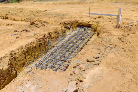 Photo for Preparation of trench for concrete deep strip foundation - Royalty Free Image