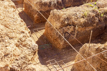 Photo for Constructing concrete foundation from digging an earthen trench - Royalty Free Image