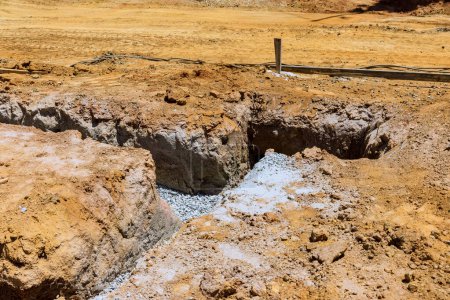 Photo for From excavation an earthen trench to pouring of concrete, earthworks are required - Royalty Free Image