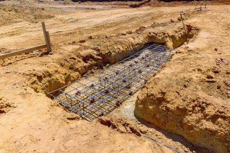 Photo for Preparations are being made for pouring of concrete into foundation trenches - Royalty Free Image