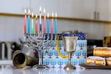 Hanukkiah Menorah candle lights during traditional celebration Hanukkah Jewish religion holiday symbol