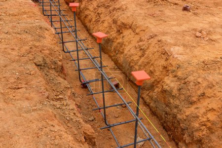 Photo for Variety earthwork is performed, including excavation an earthen trench for foundations pouring of concrete - Royalty Free Image