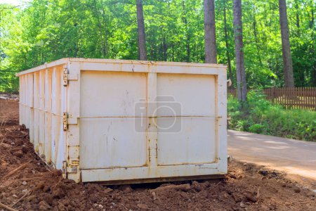 Photo for Construction site has metal container dumpster for junk waste - Royalty Free Image