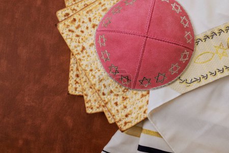 Traditional Jewish ritual with unleavened bread Matzah tallit kippah during Passover holiday