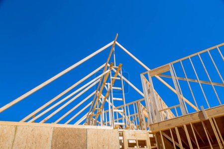 In new home construction, timber wood stick frames frame beams